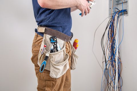 electrician builder at work examines the cable co 2023 11 27 04 58 04 utc