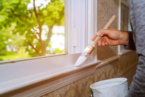 male hands repairs painting window trim at home cl 2023 11 27 05 36 04 utc