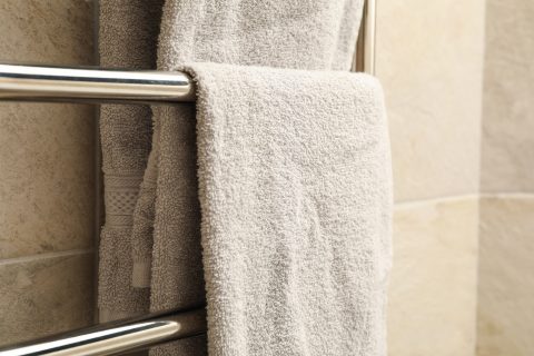 modern heated towel rail on tiled bathroom wall 2023 11 27 04 51 56 utc