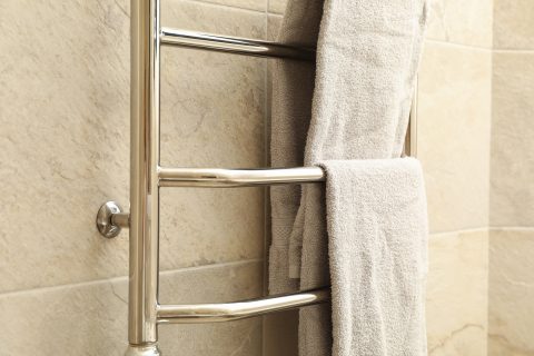 modern heated towel rail on tiled bathroom wall 2023 11 27 05 05 11 utc