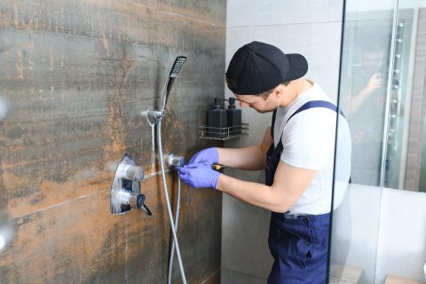 plumber installing water taps shower stall work i 2023 11 27 05 00 38 utc