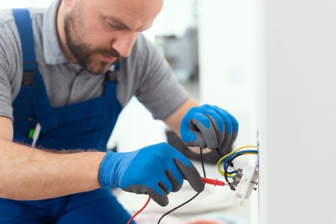 professional electrician testing an outlet 2023 11 27 05 11 07 utc