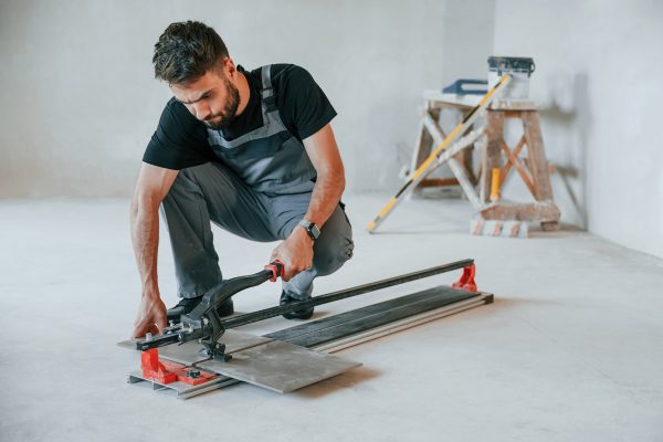 tile cutting process the man is making repairs in 2023 11 27 05 26 29 utc