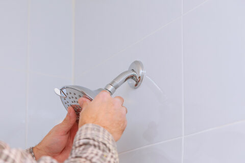 workman repairing shower head in bathroom drops wa 2023 11 27 05 19 15 utc